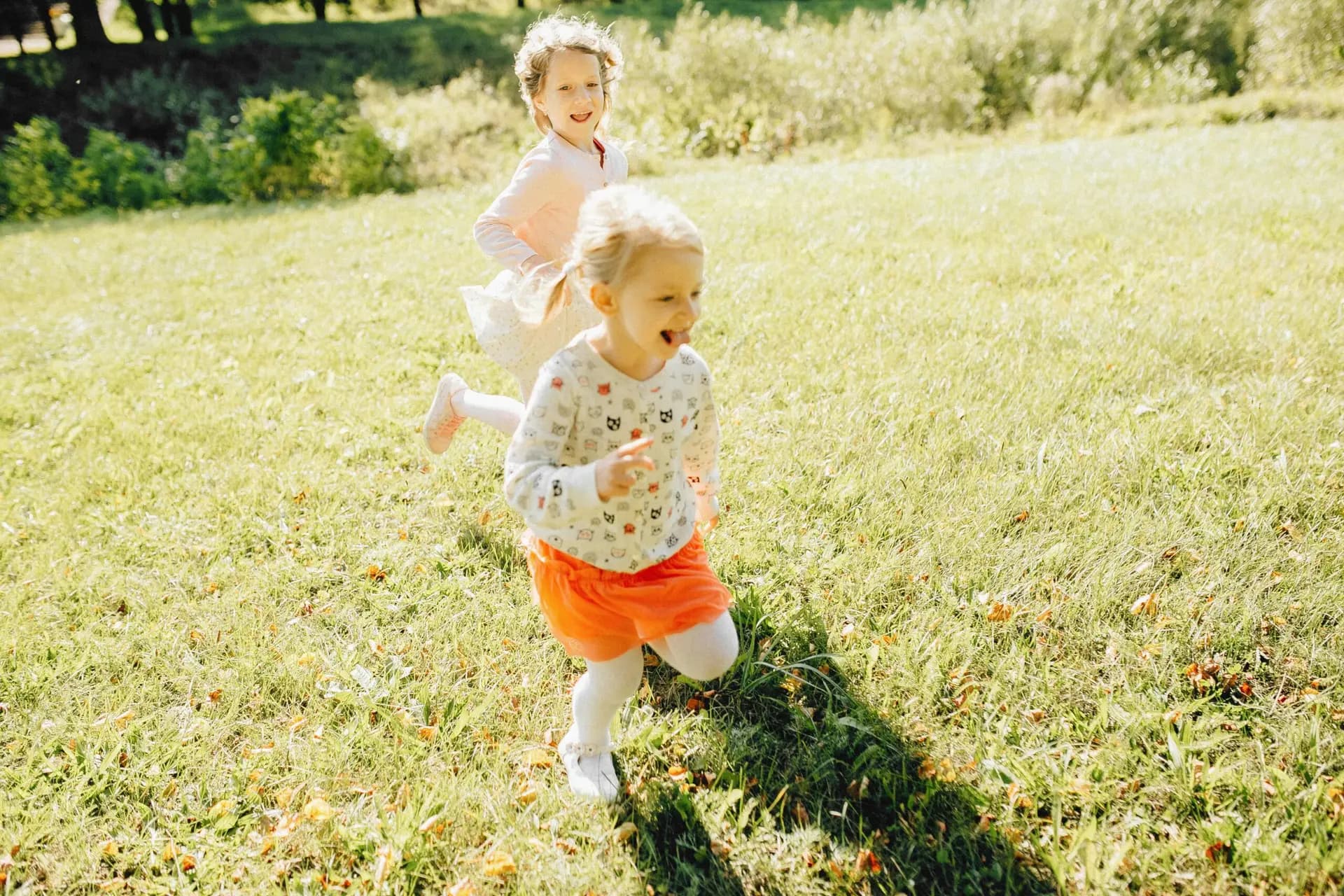 Children playing outdoors, from the Kids First Childcare website